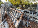 a pile of junk in the yard of a house