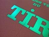 a sign that says tir on the floor of a building