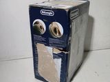 a box that is sitting on the floor next to a wall