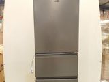 an image of a stainless steel refrigerator in a warehouse