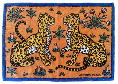 a painting of two leopards sitting on top of a rug