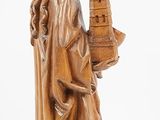 wooden statue of a woman holding a bird cage and a bird house