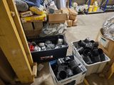 two bins of assorted items in a garage
