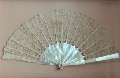 a picture of a picture of a white fan on a wall