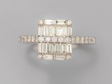 a diamond and white gold ring with baguets of diamonds