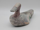 une image représentant une figurine de canard sur fond blanc