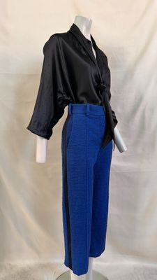 blue pants with a black shirt on a mannequin base