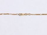 a close up of a gold chain on a white background