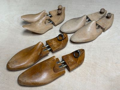 several wooden shoes are lined up on a table