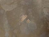 aerial view of a pair of scissors on a dirty surface