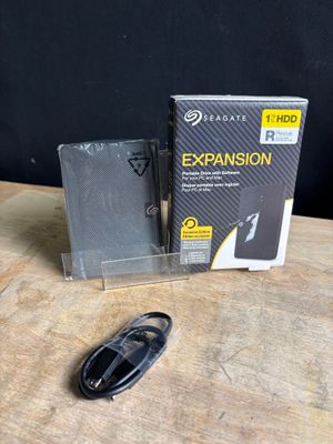 a box and a mouse on a table next to it