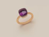 a gold ring with a purple stone on top of it