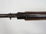 a close up of a rifle on a white surface with a white background