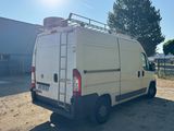 a white van that is parked in the dirt