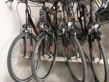 many bikes that are parked next to each other in a parking garage