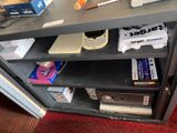 a book shelf with a bunch of books on top of it