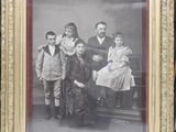 an old photo of a group of people posing for a picture