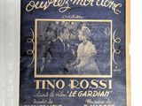an old movie poster of a man and a woman on the cover of a magazine
