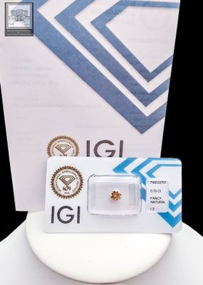 a small diamond in the box on the table