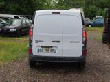 a white van that is parked in a parking lot