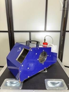 a blue machine that is sitting on top of a table