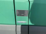 a close up of a car ' s door with a sticker on it