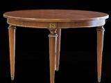 une table à manger ovale à deux pieds, avec un plateau en bois