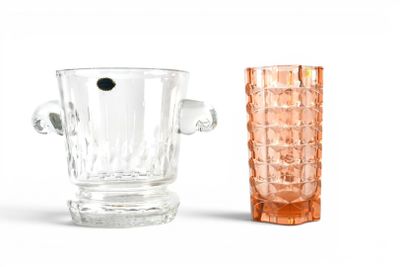 two vases sitting next to each other on a white surface