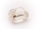 a close up of a clear quartz stone on a white surface