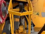 a yellow machine that is sitting on the ground
