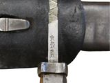 a close up of a knife on a metal pole