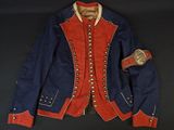 a blue jacket with red trim and buttons on a black background