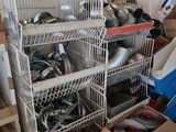 a lot of pots and pans that are in a cage