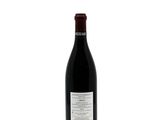 a bottle of wine that is sitting on a table