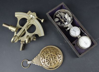 two different types of brass items in a box