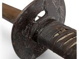 a close up of a samurai sword with a wooden handle