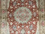 an antique persian rug with a medallion design on a red ground