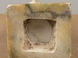 marble block shaped like a square with a hole in the middle
