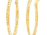 une paire de boucles d'oreilles créoles en or jaune serties de diamants