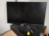 a computer desk with a monitor, keyboard, mouse and mouse