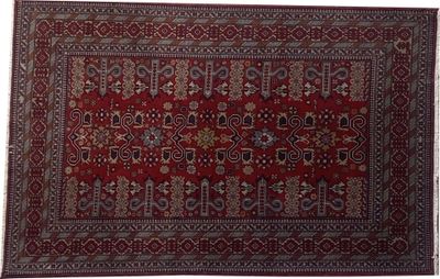 un tapis rouge orné d'un médaillon