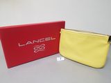 a yellow and red bag sitting next to a red box
