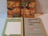 two books sitting on a table next to each other on top of a table