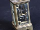 a small clock that is sitting on a table