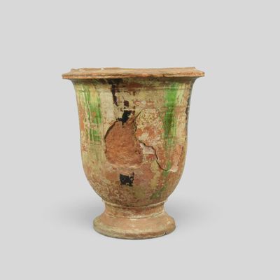 an old vase that is sitting on a table