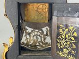 a clock that is sitting inside of a wooden case