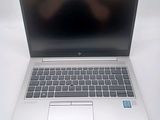 a laptop that is sitting on a white table