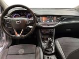 the interior of a car with a steering wheel and dashboard controls