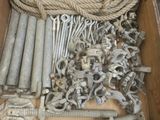 a wooden box filled with assorted metal items