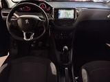 the interior of a small car with a steering wheel and dashboard